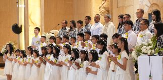 Menyambut Kristus dalam Ekaristi: Perayaan Komuni Pertama di Paroki St. Ignatius Manado